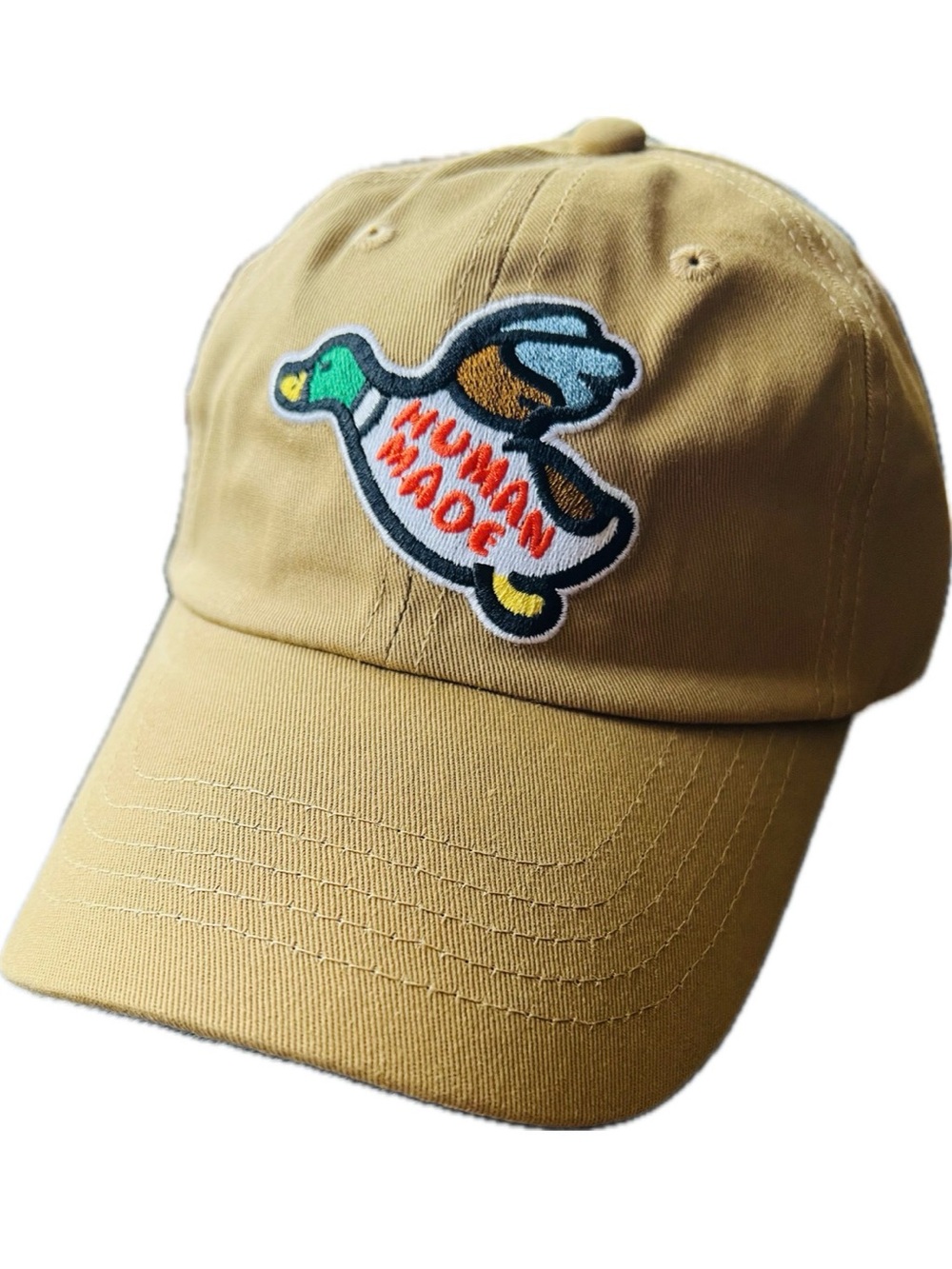 Human Made tan cap with embroidered tiger label